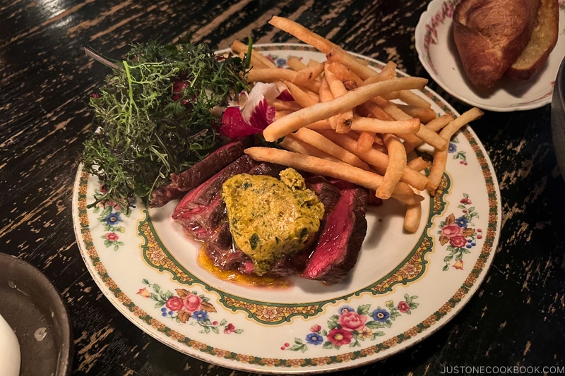 steak frites on a colorful plate