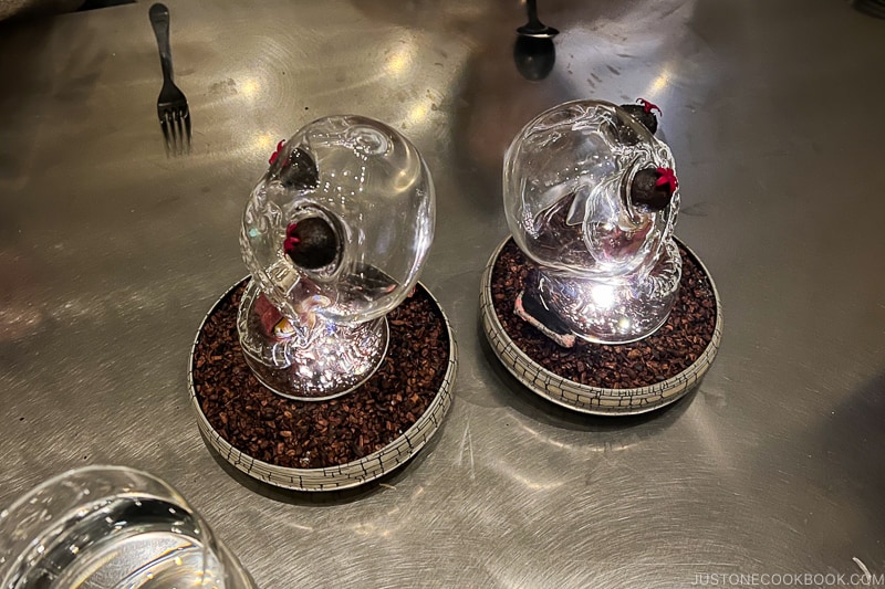 two skull shaped tableware on a metal table