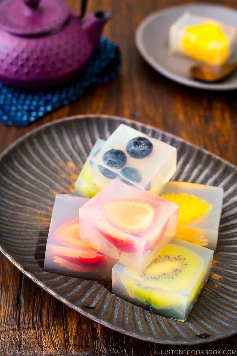 A black ceramic containing Fruit Jelly.