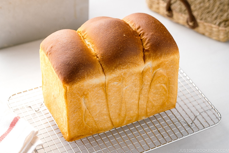 Round-topped Japanese Milk Bread (Shokupan) on a wire rack.