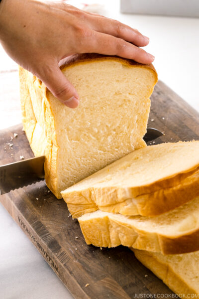 Slicing the Japanese Milk Bread (Shokupan) with a knife.
