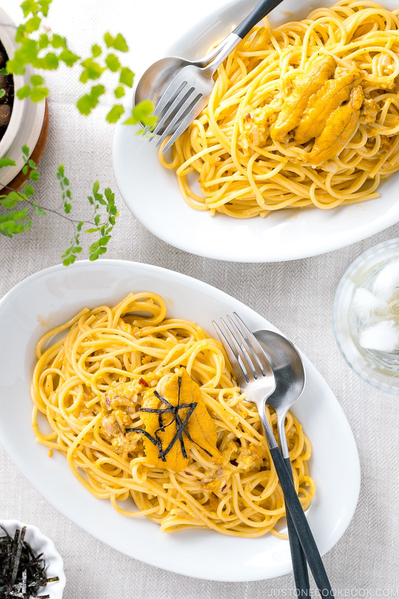 A white oval plate containing Uni Pasta (Japanese sea urchin pastsa).