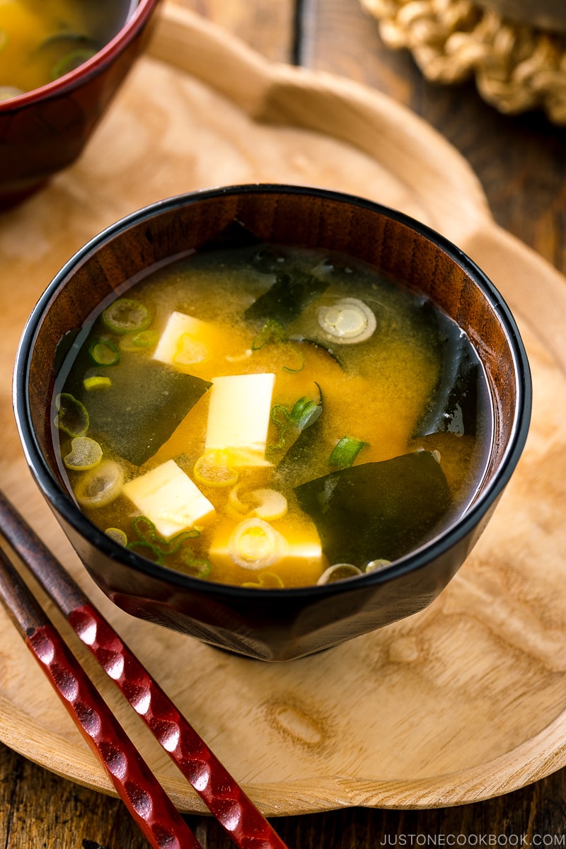 Japanese miso soup bowl containing tofu and wakame miso soup.
