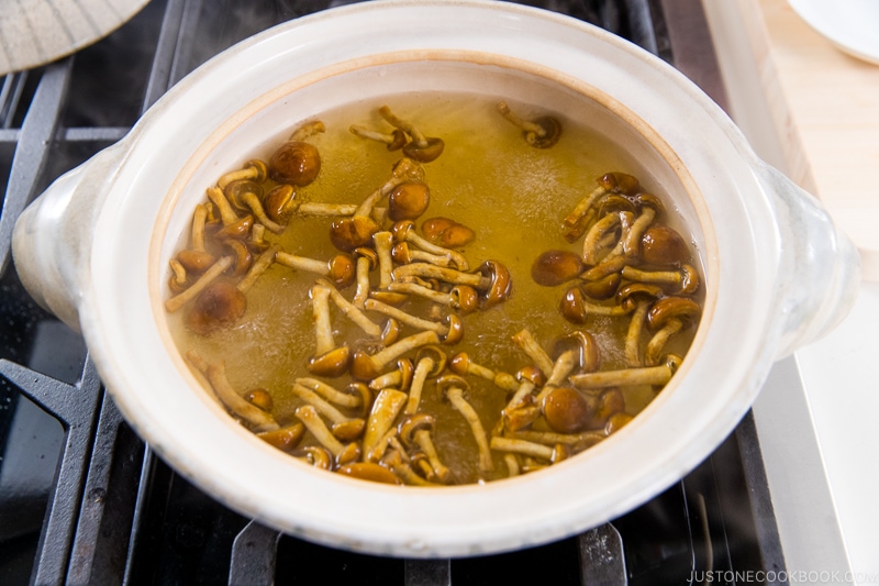 Japanese miso soup bowls containing tofu and wakame miso soup.