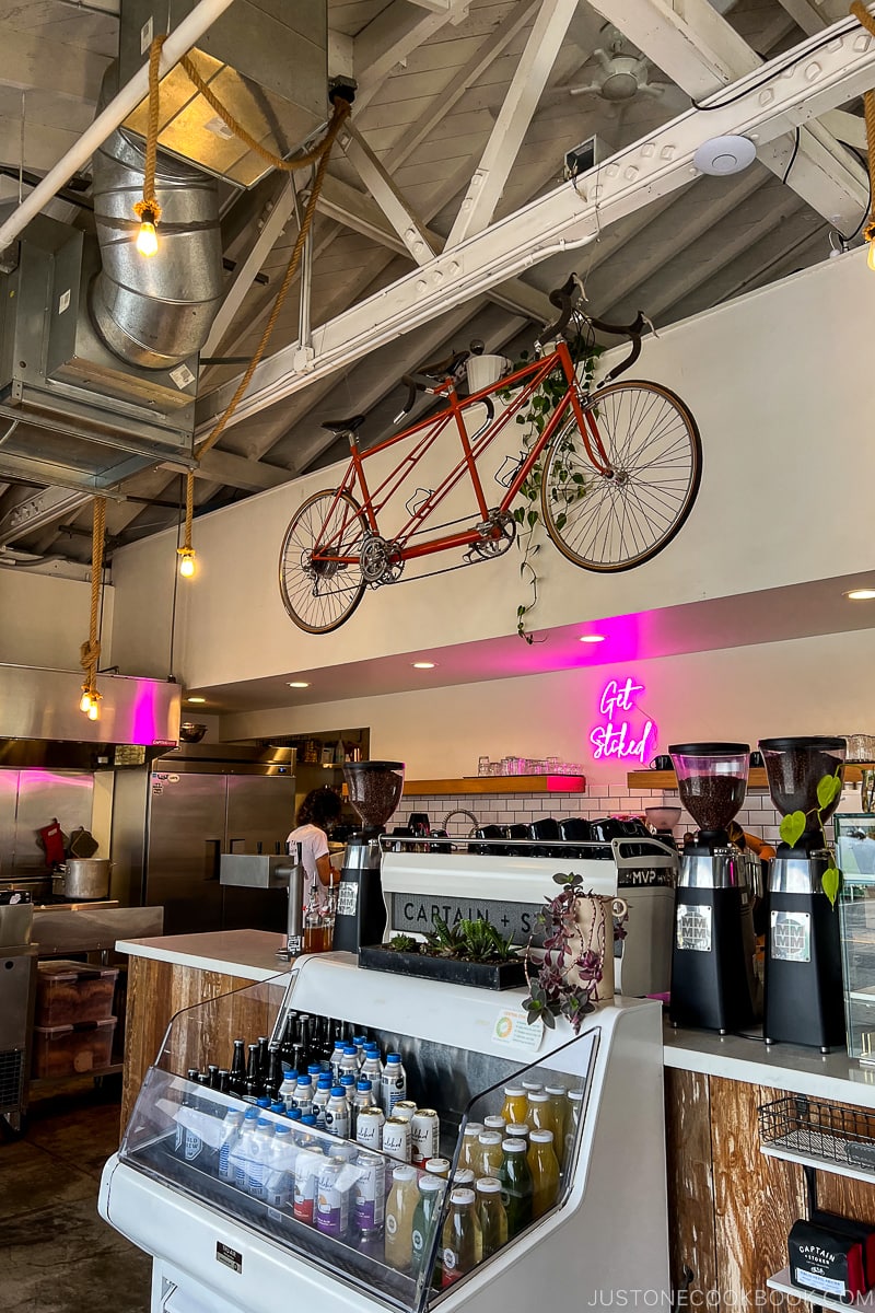 bike hanging from rafter in a cafe