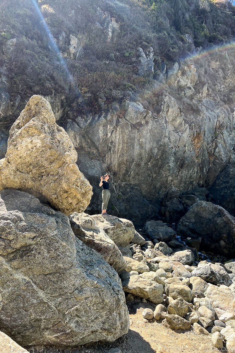 a girl standing on a rock at Partington Point