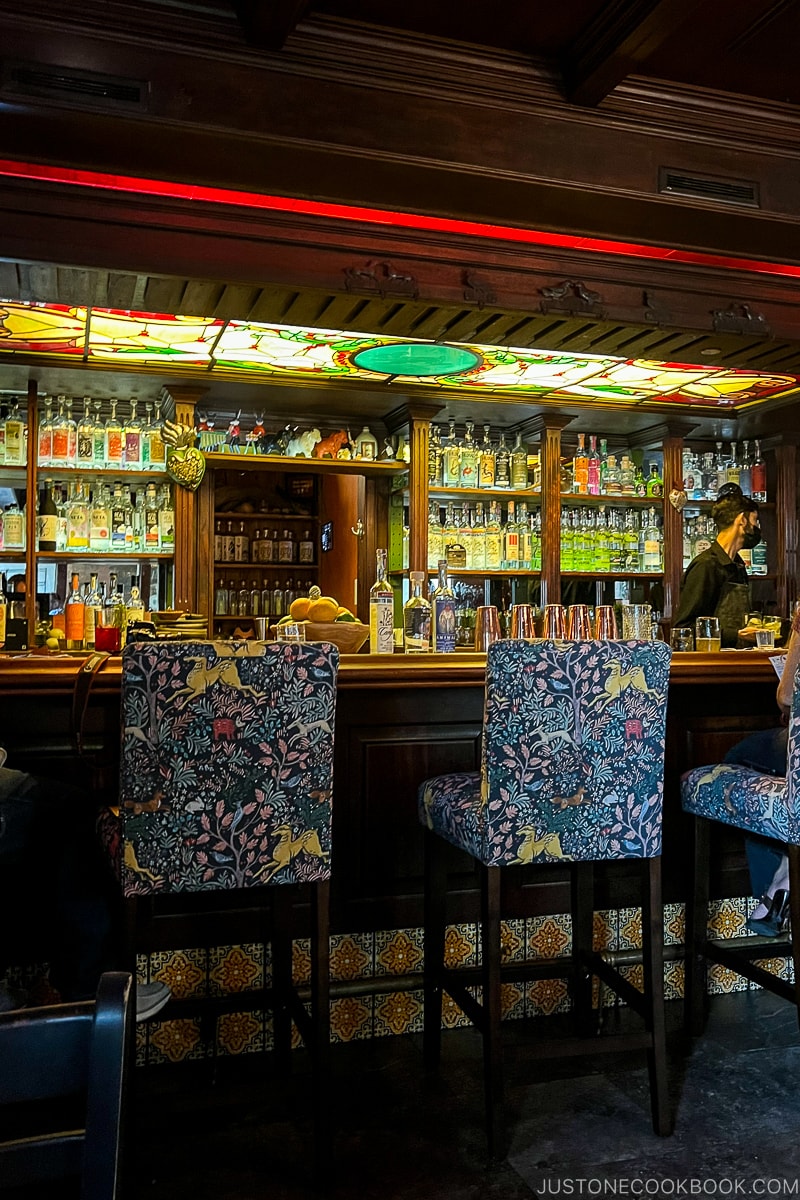 colorful stools next to a bar