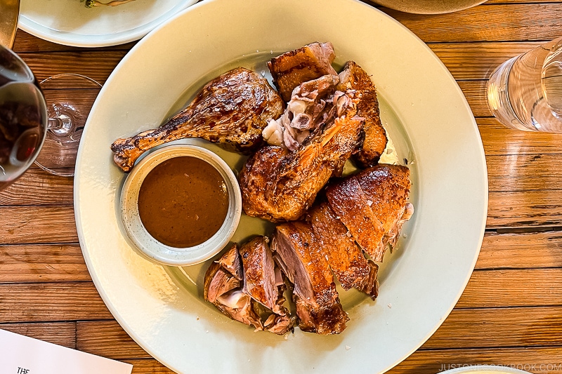 dry age duck on a white plate