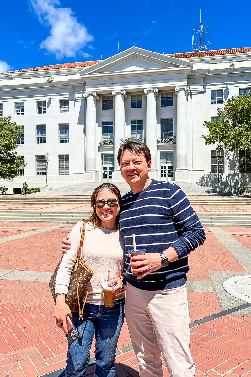 a couple standing in front of Sproul Hall