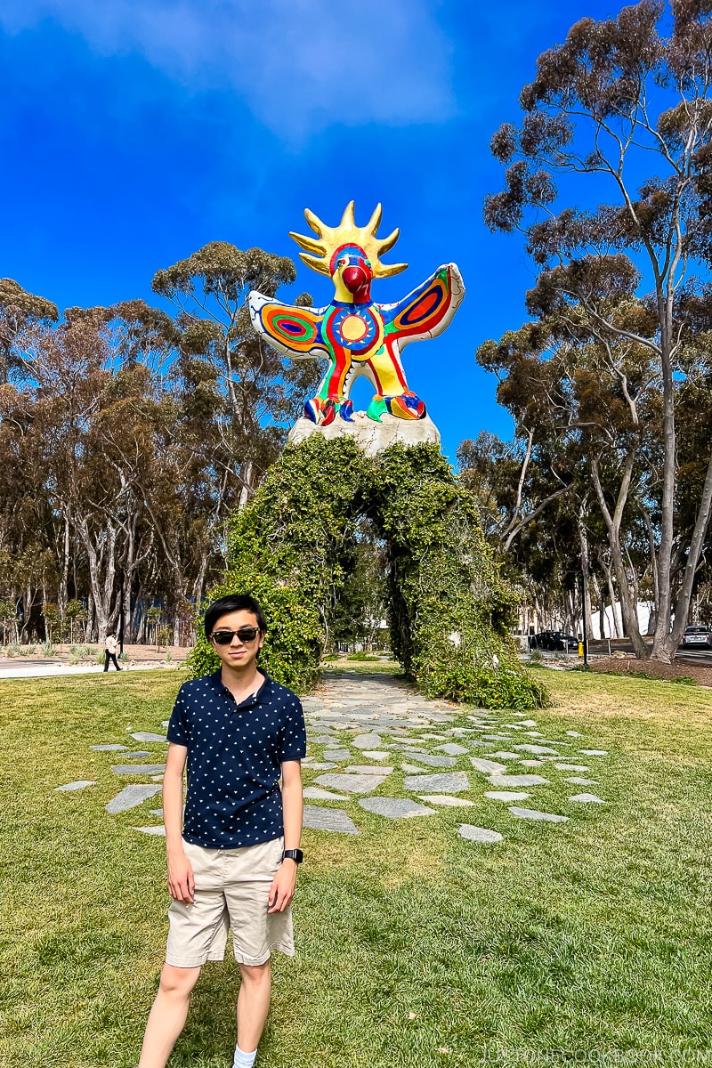 boy next to Sun God Statue