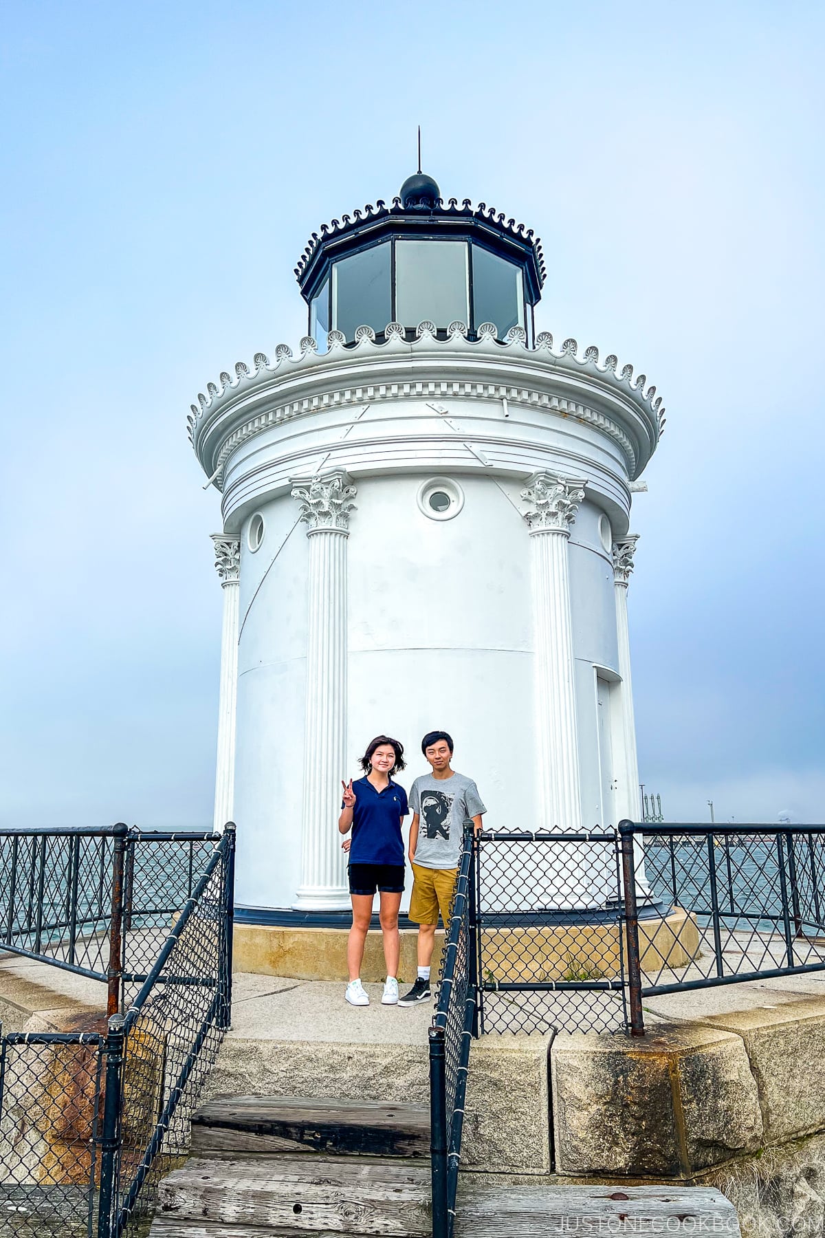 a boy and a girl in front of Bug Light
