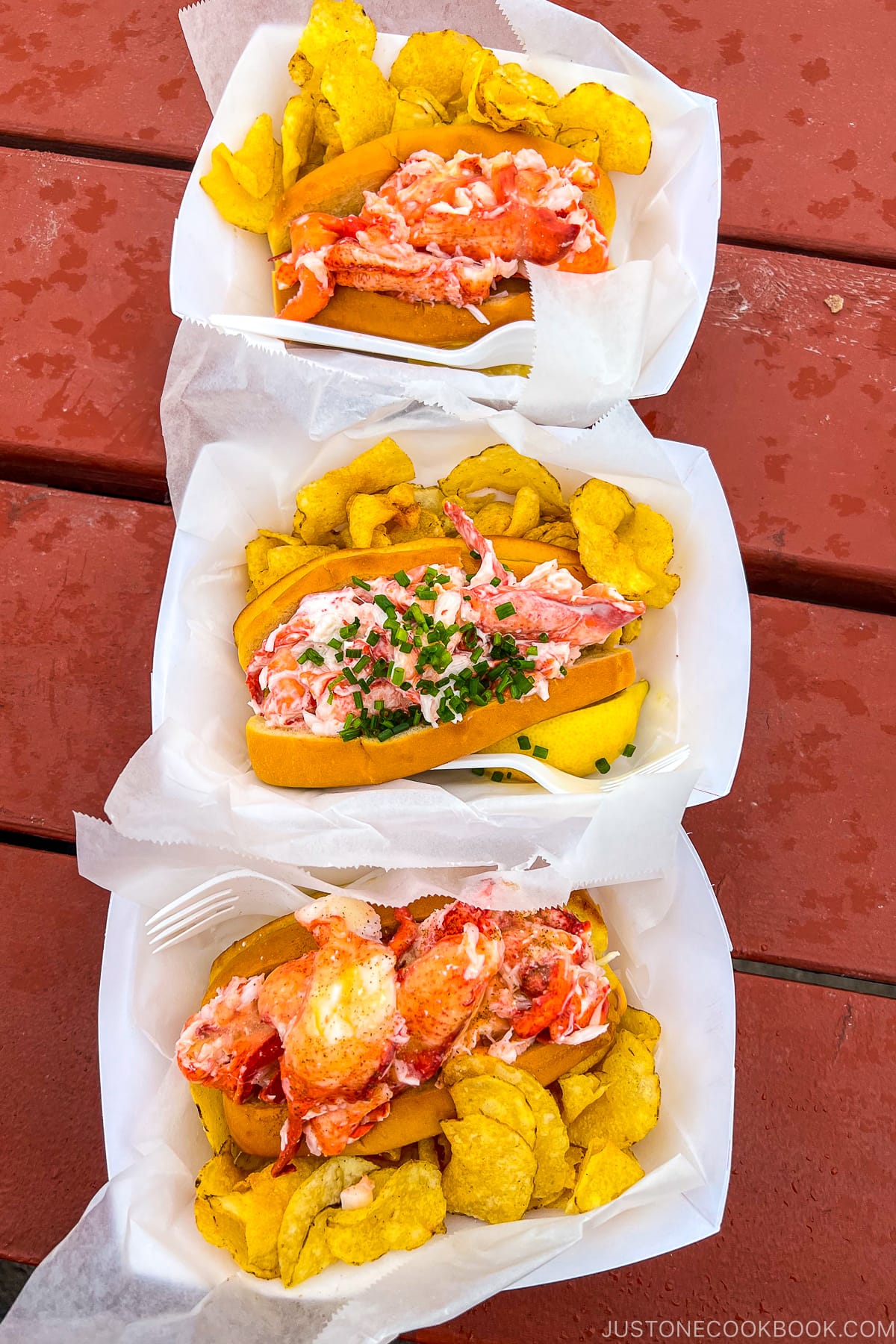 three types of lobster roll on a table