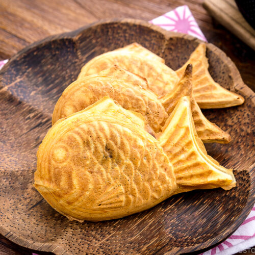 Taiyaki served on a wooden plate.