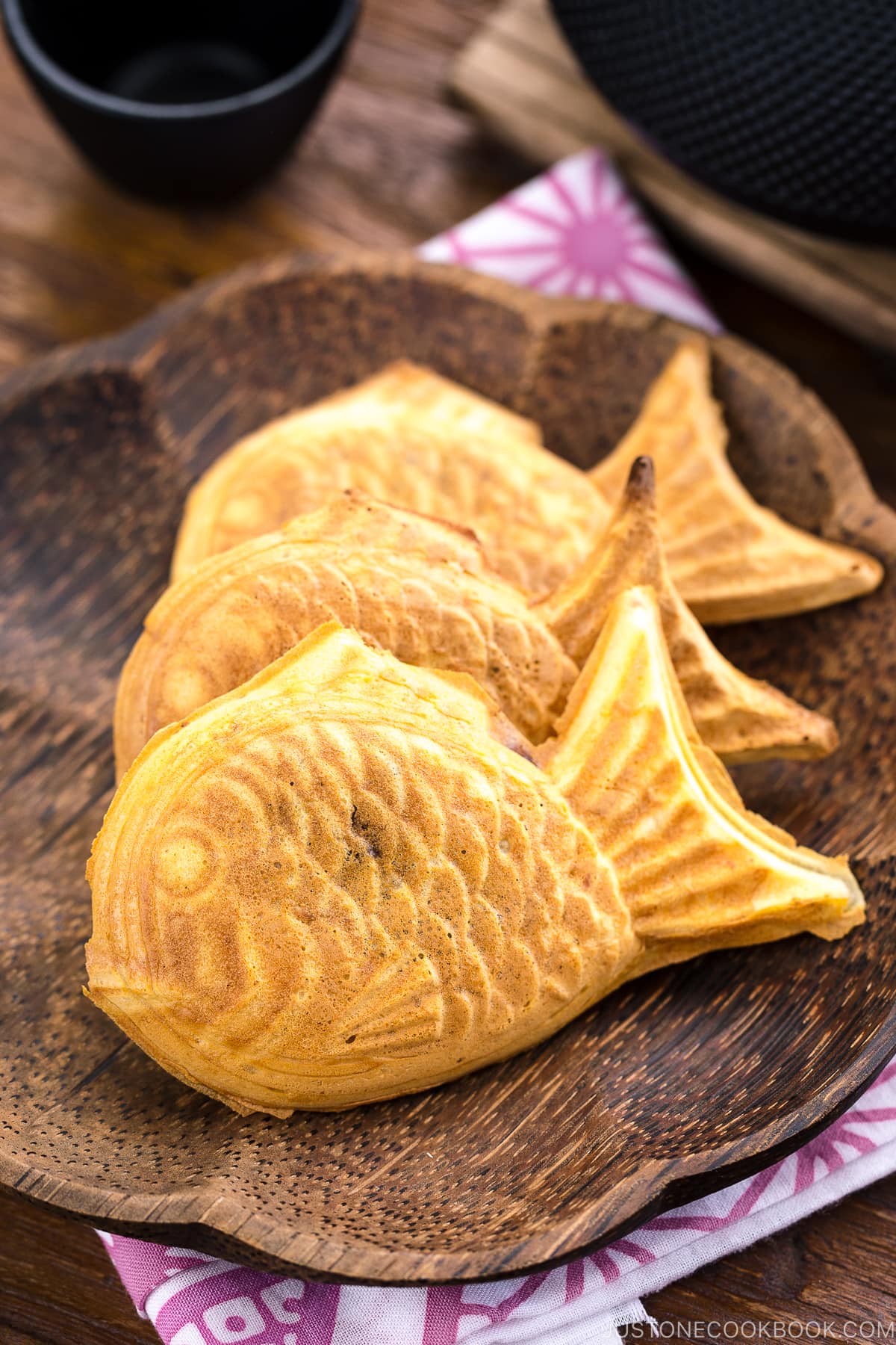 Taiyaki served on a wooden plate.