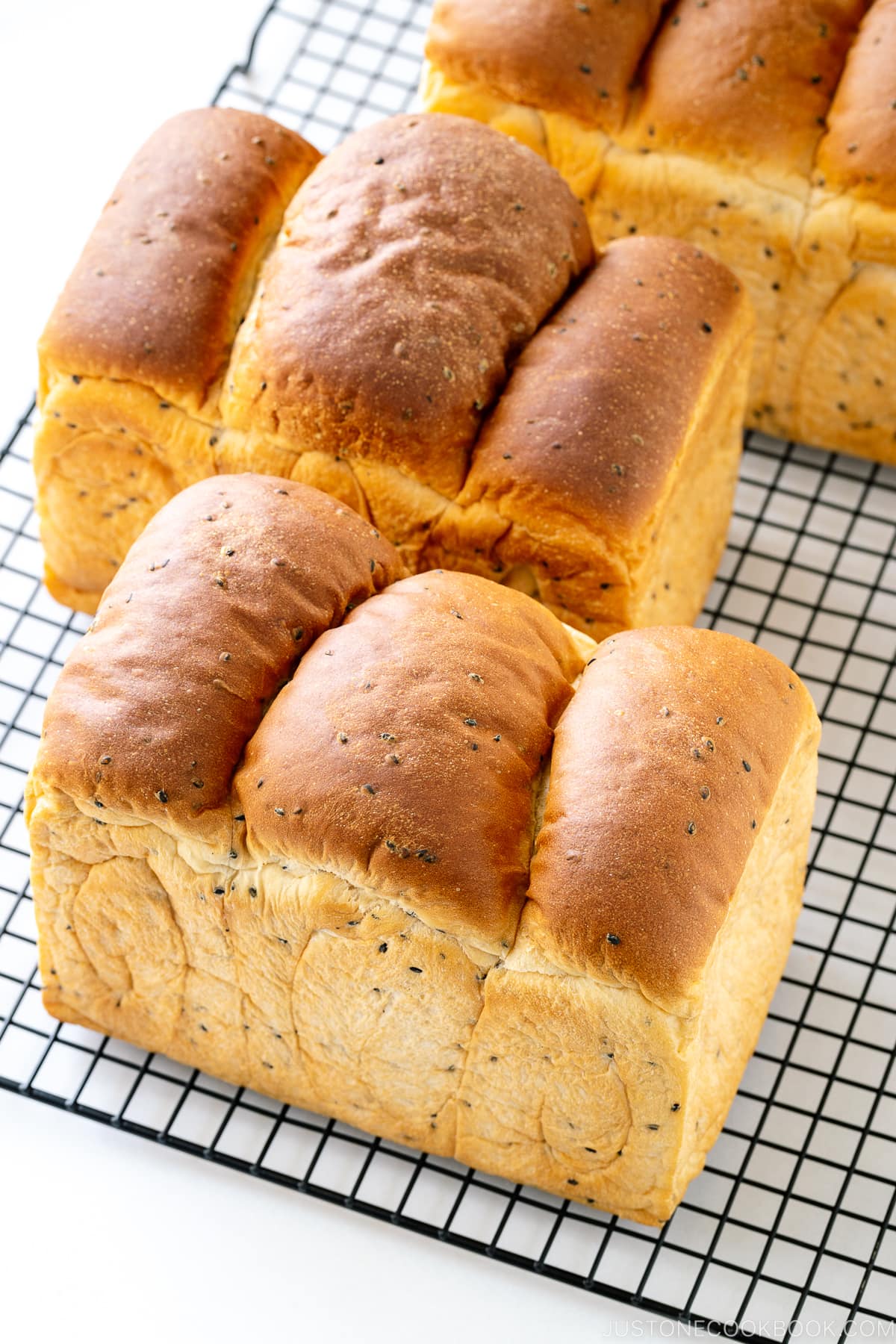 Three loaves of round-top Black Sesame Shokupan (Japanese milk bread).