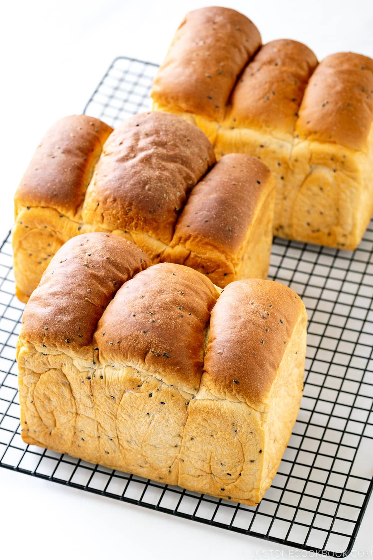 Three loaves of round-top Black Sesame Shokupan (Japanese milk bread).