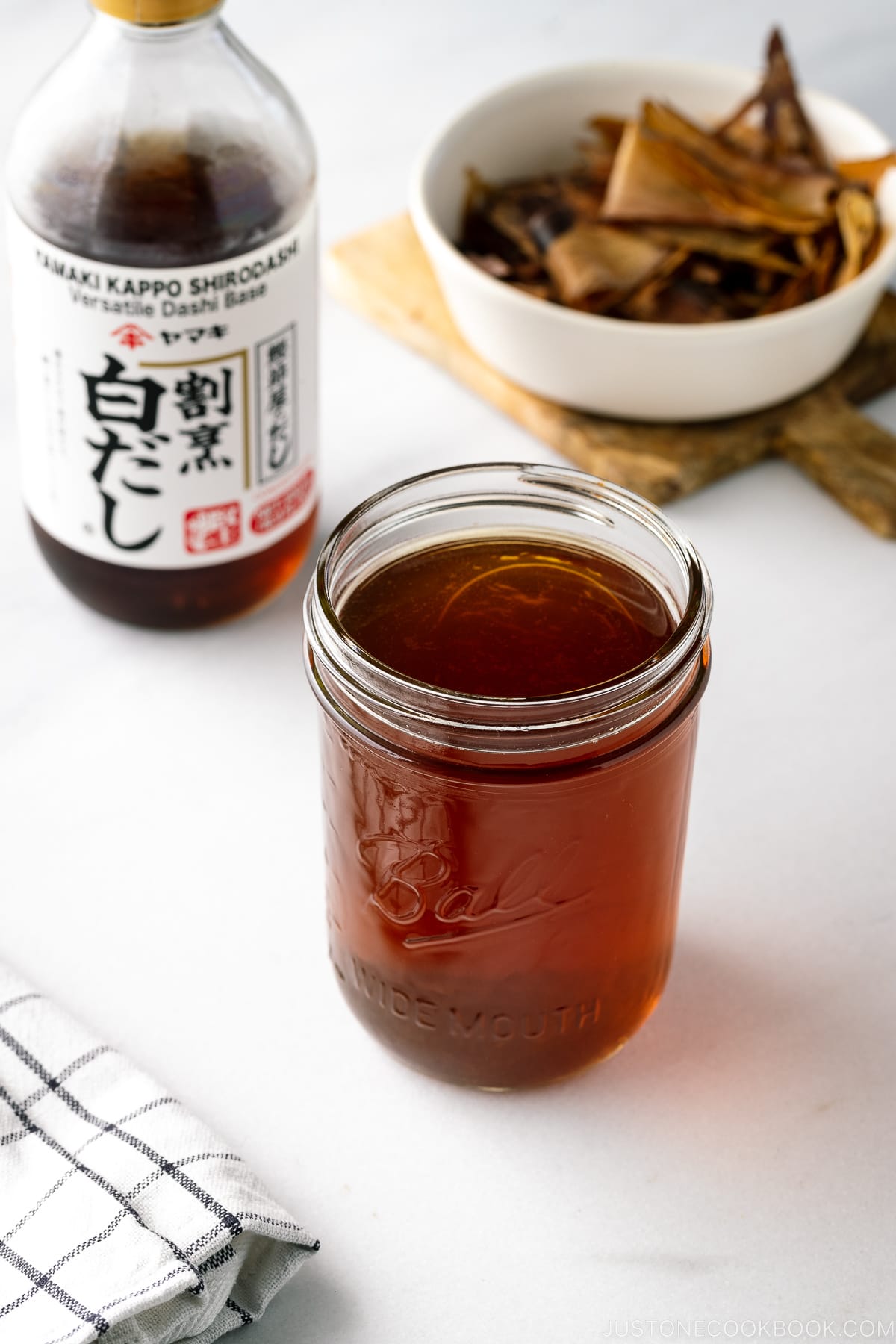 A mason jar containing Homemade Shiro Dashi (Versatile Dashi Base).