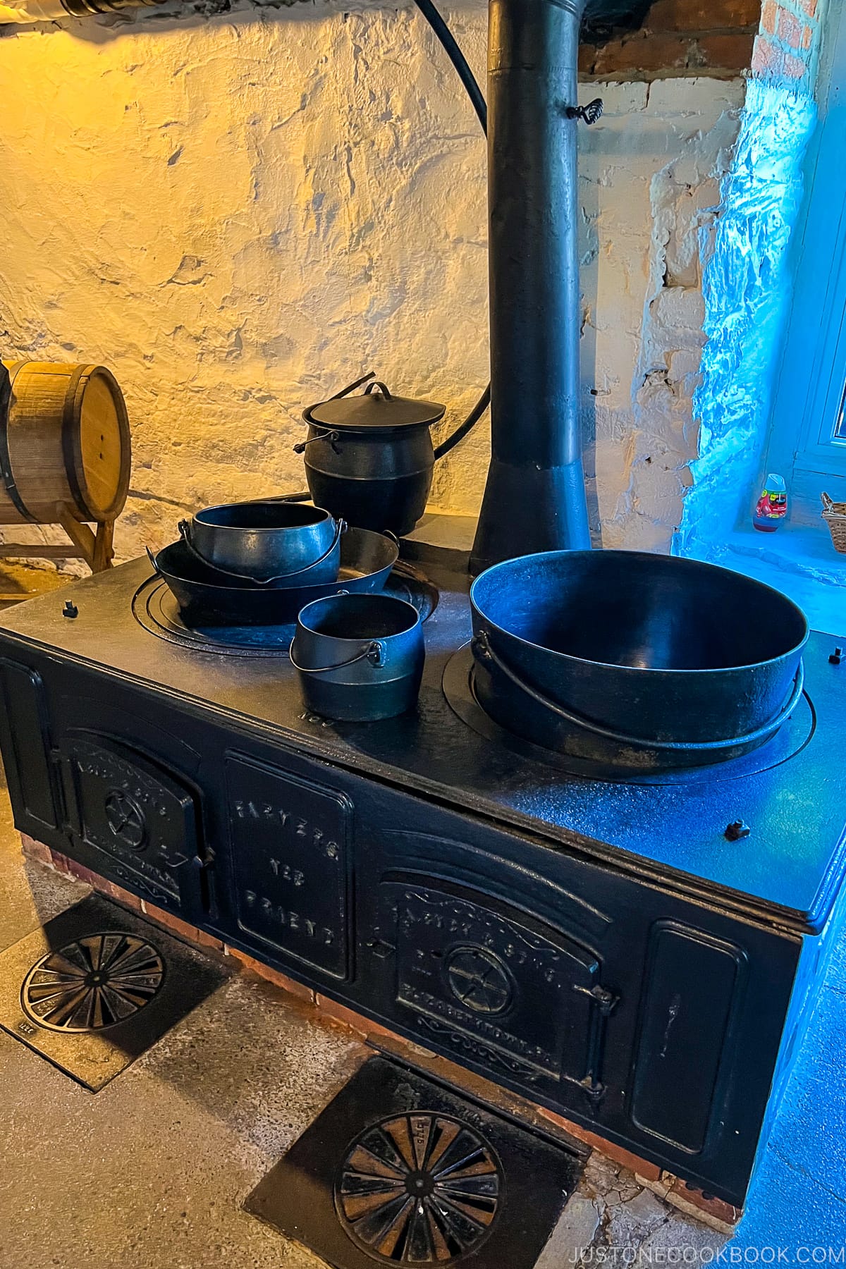 antique stove with metal pots