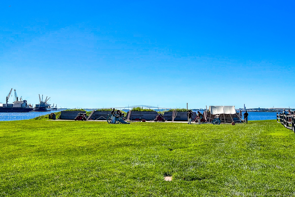 cannons on a lawn next to Patapsco River