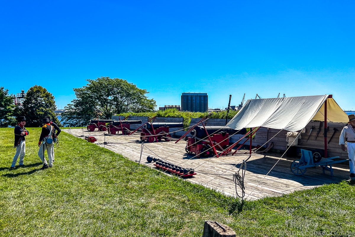 cannons on a wood platform next to Patapsco River