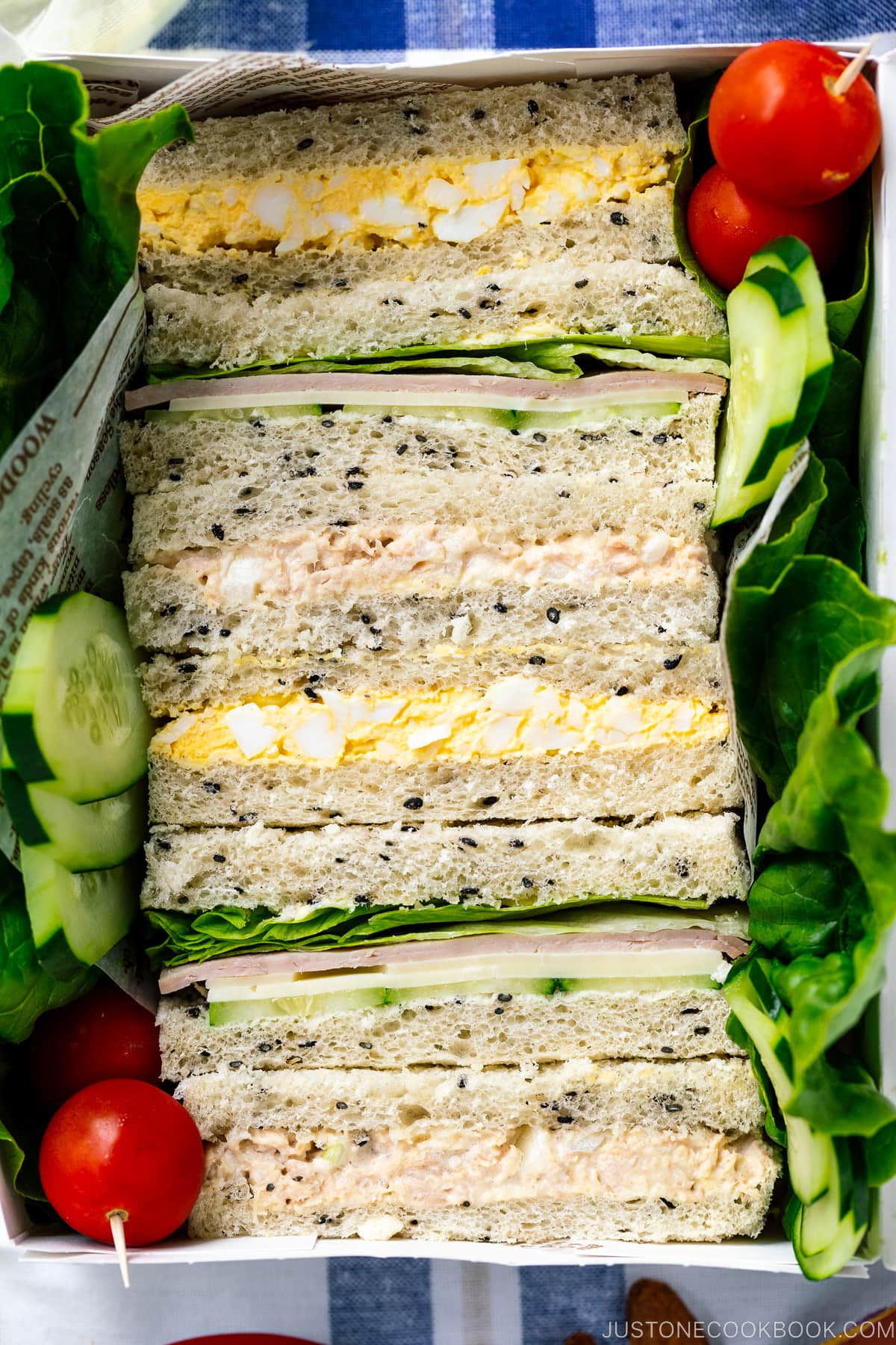 A paper box containing Japanese Sandwiches (Mixed Sando).