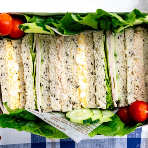 A paper box containing Japanese Sandwiches (Mixed Sando).