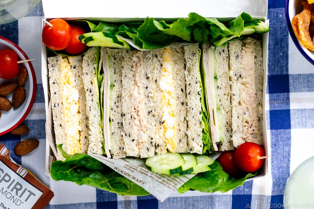 A paper box containing Japanese Sandwiches (Mixed Sando).