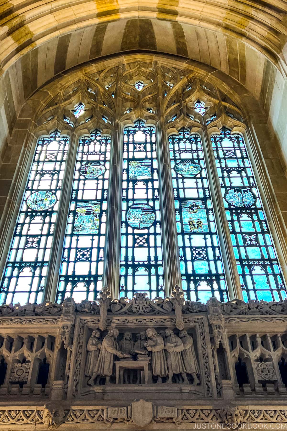 stained glass window and carvings inside Bass Library at Yale University