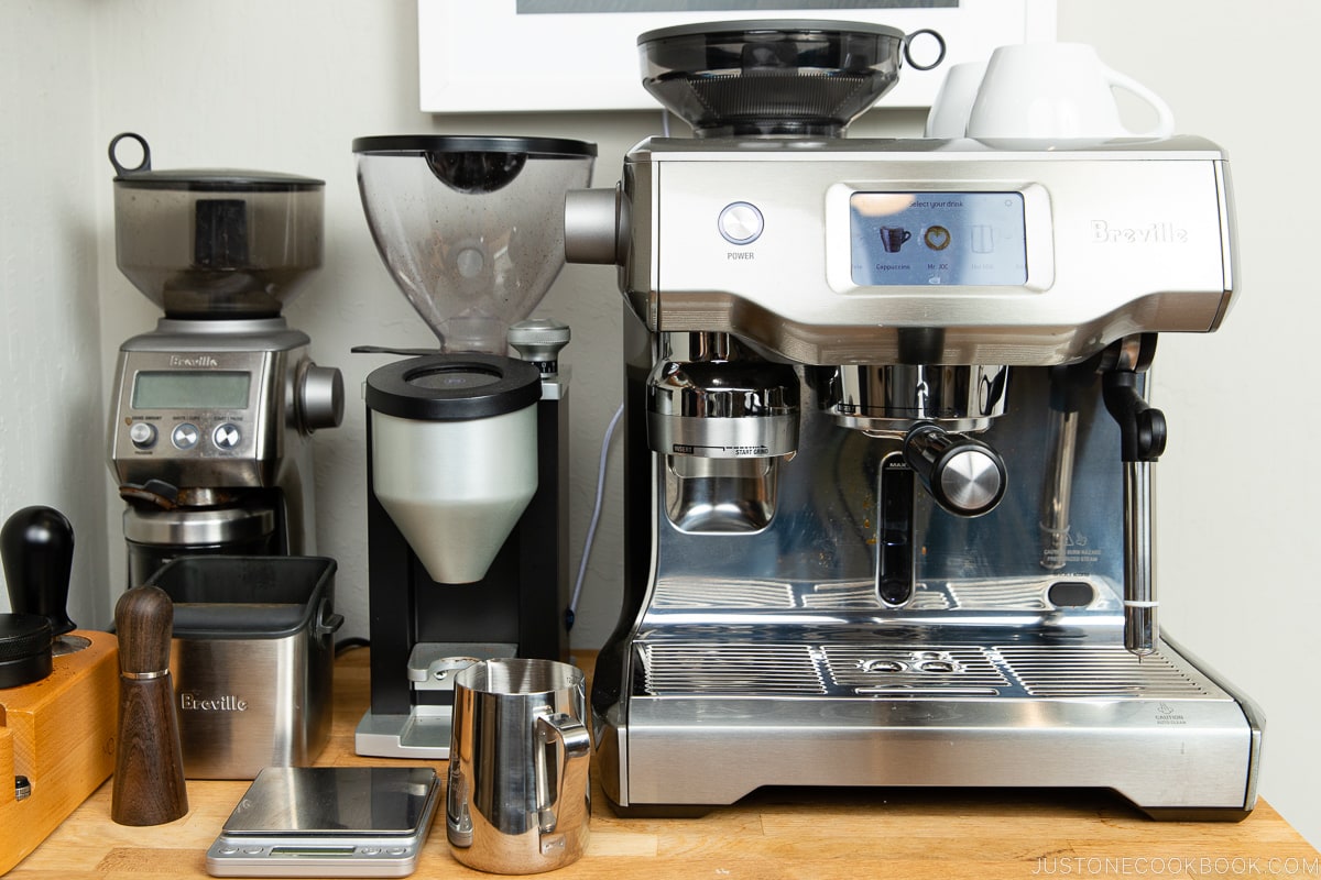 coffee machine and grinder on a wood table