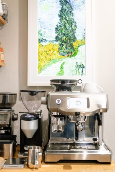 coffee machine and grinder on a wood table