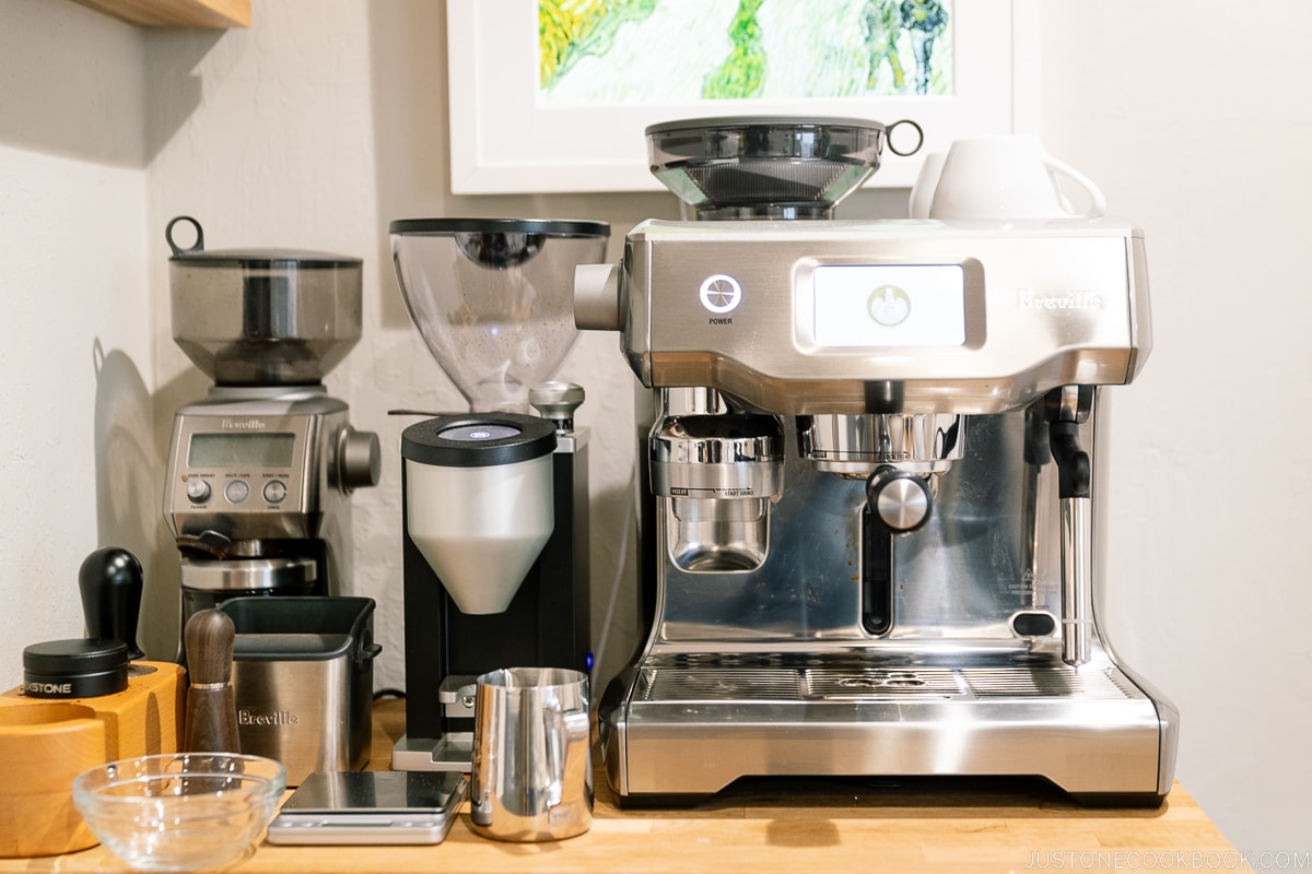 coffee machine and grinder on a wood table