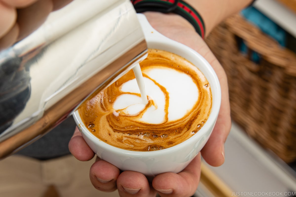 milk being poured into espresso