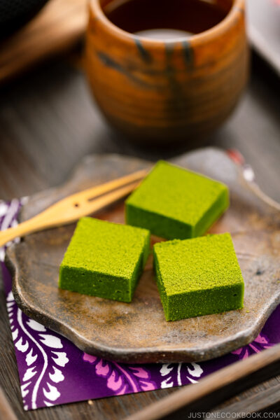 A Japanese plate containing matcha chocolate.