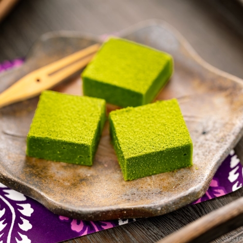 A Japanese plate containing matcha chocolate.