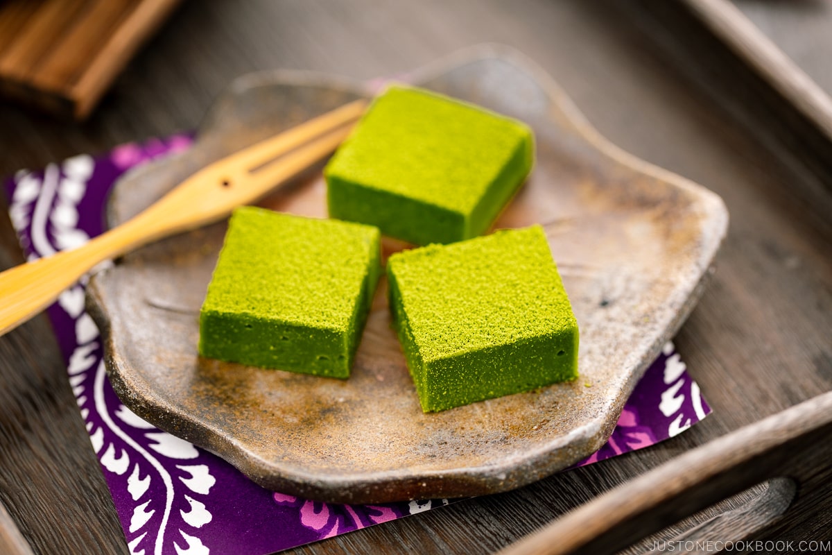 A Japanese plate containing matcha chocolate.