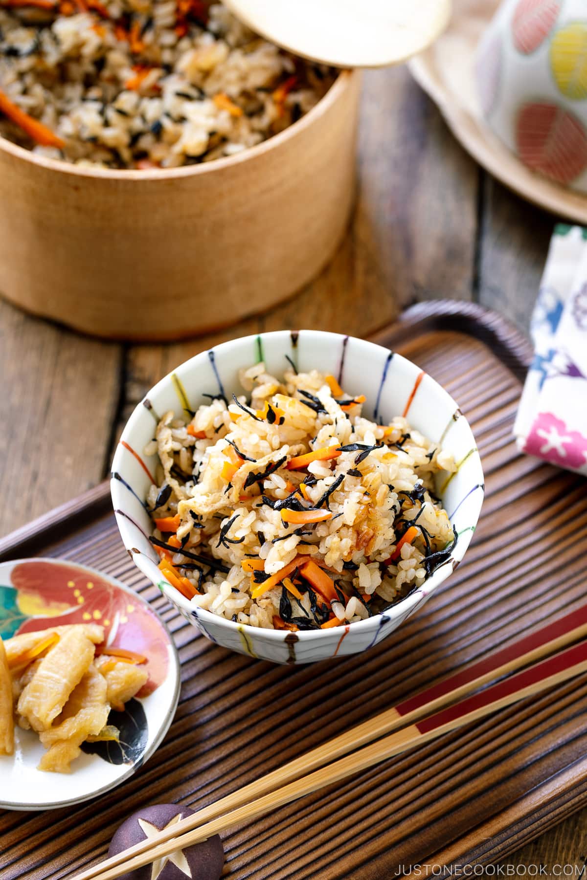 A rice bowl containing Hijiki Rice (Takikomi Gohan) served with pickles on the side.