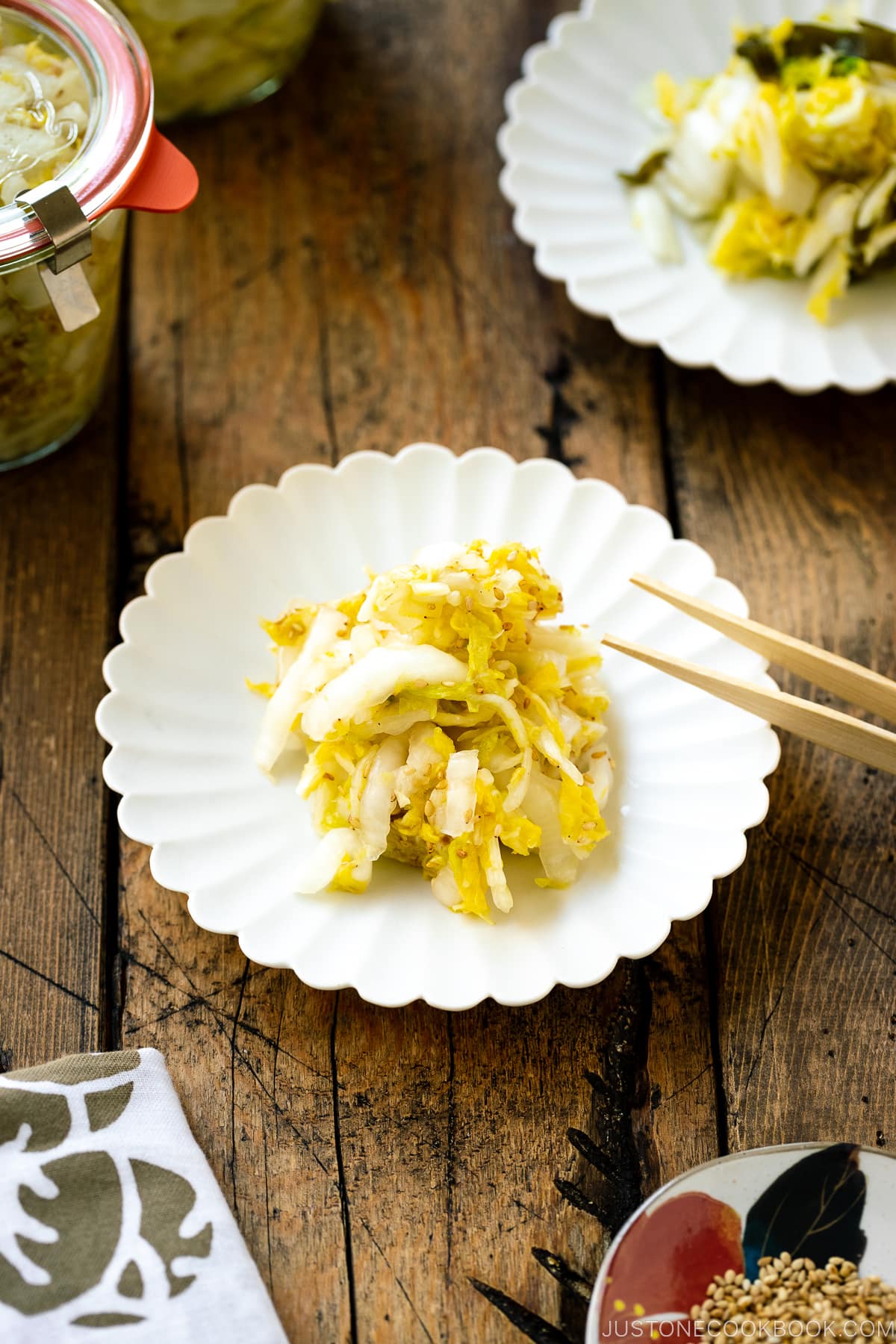 A white ceramic plate containing Napa Cabbage Pickles (Tsukemono).