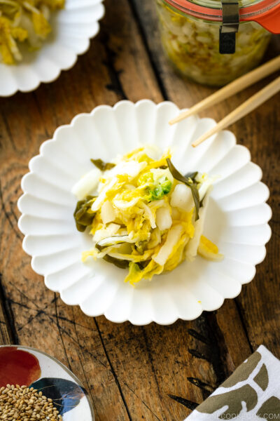 A white ceramic plate containing Napa Cabbage Pickles (Tsukemono).  Gyudon (Crimson meat Bowl) Napa Cabbage Pickles 0871 II 400x600