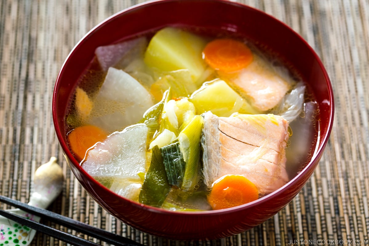 Red lacquered bowls containing Sanpeijiru (Japanese Salmon Soup).