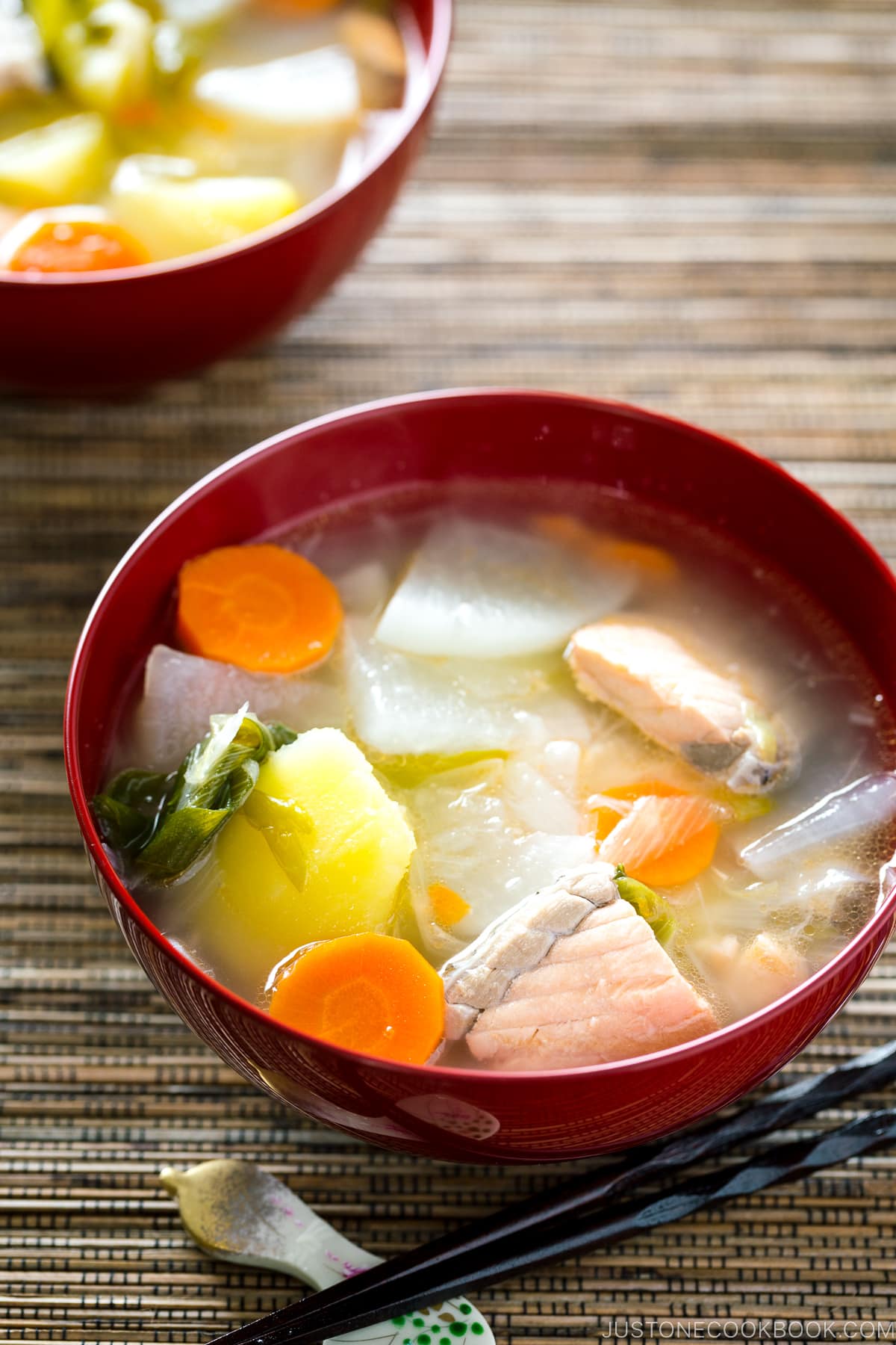 Red lacquered bowls containing Sanpeijiru (Japanese Salmon Soup).