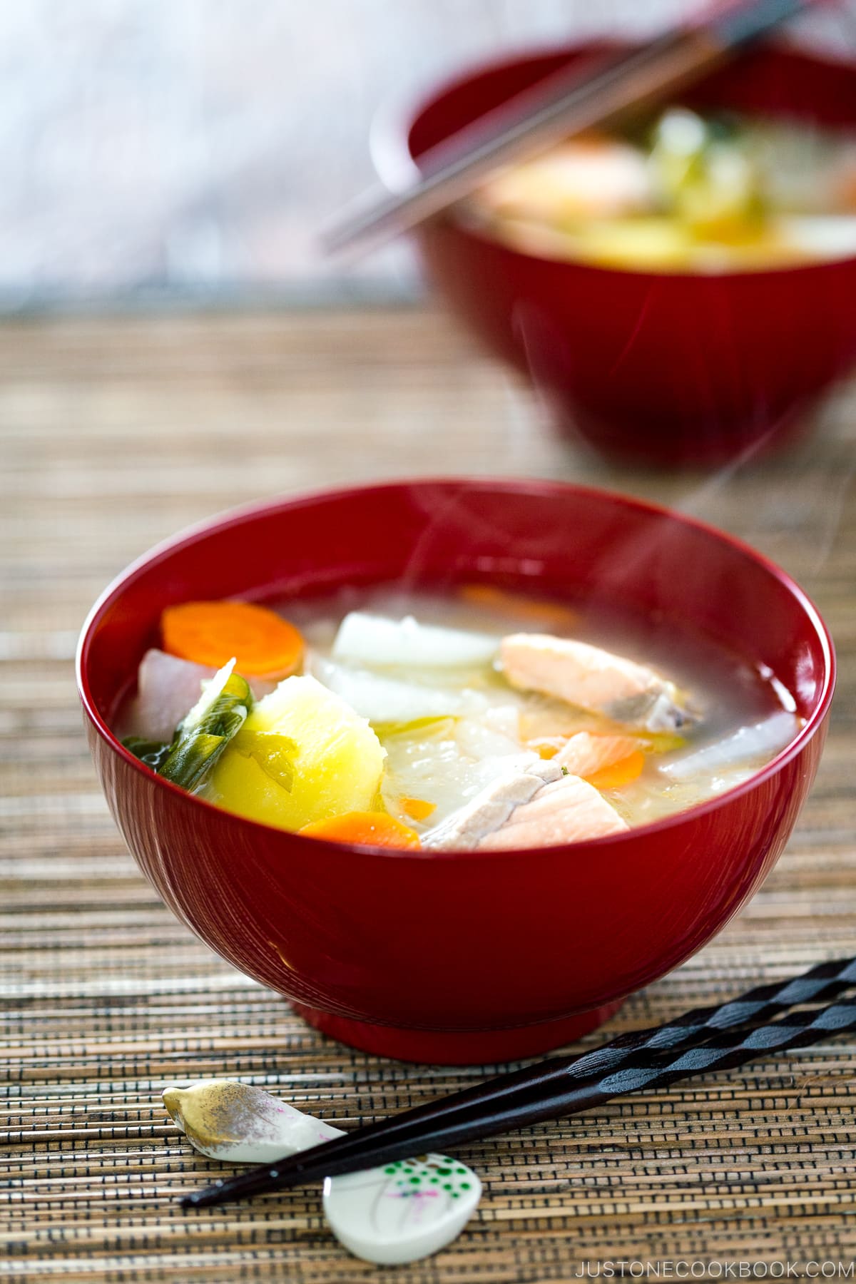 Red lacquered bowls containing Sanpeijiru (Japanese Salmon Soup).