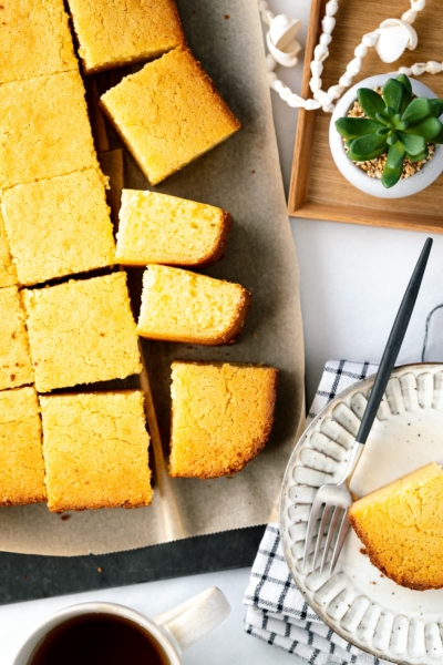 Slices of butter mochi on the cutting board.