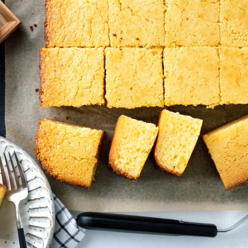 Slices of butter mochi on the cutting board.