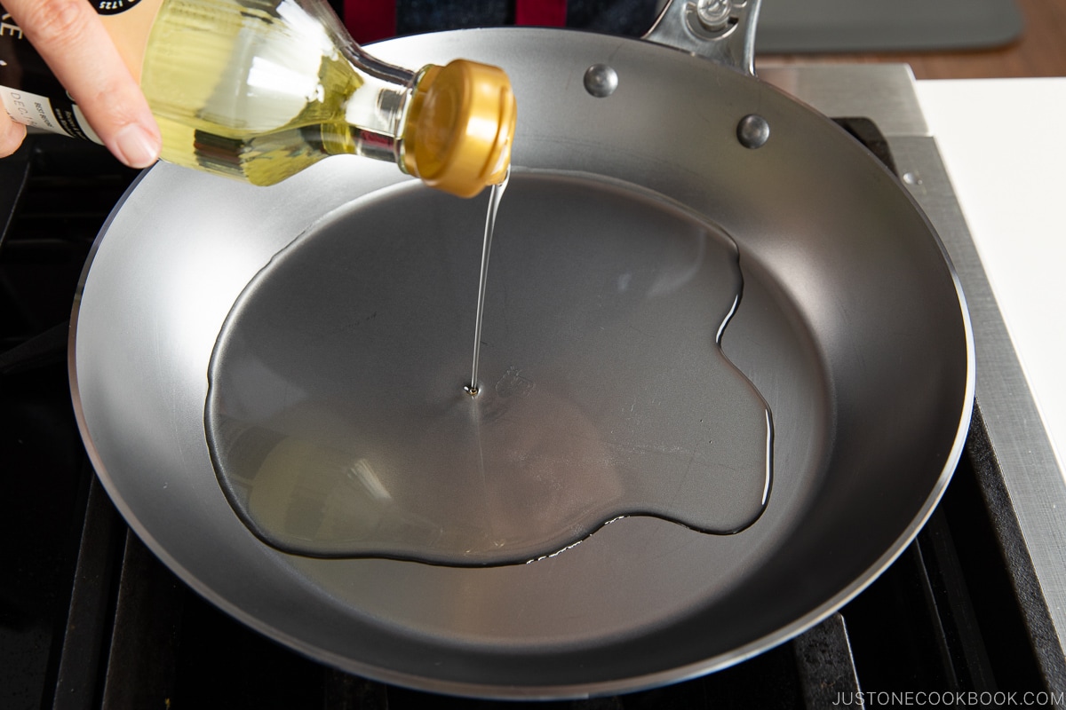 pour oil in fry pan