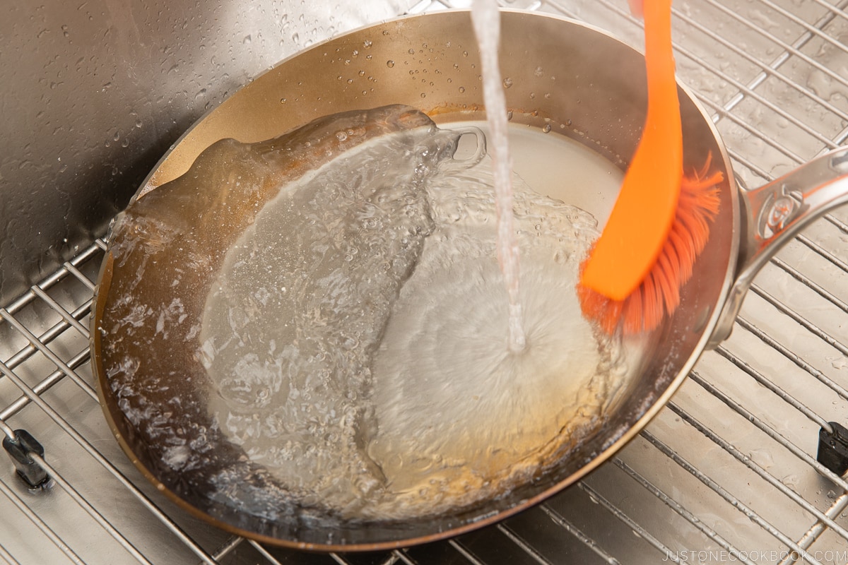 hot water running on a fry pan