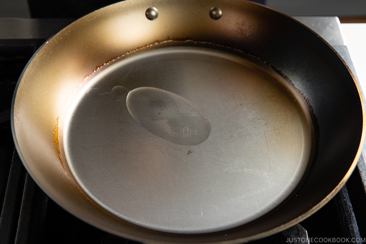 small amount of oil inside a fry pan