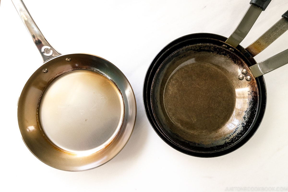 several carbon steel pan stacked on top of each other