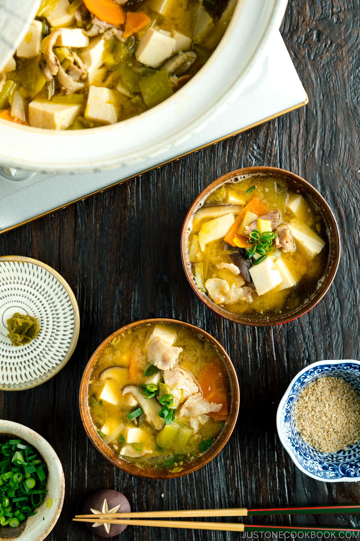 Miso soup with yuzu kosho served on the table.