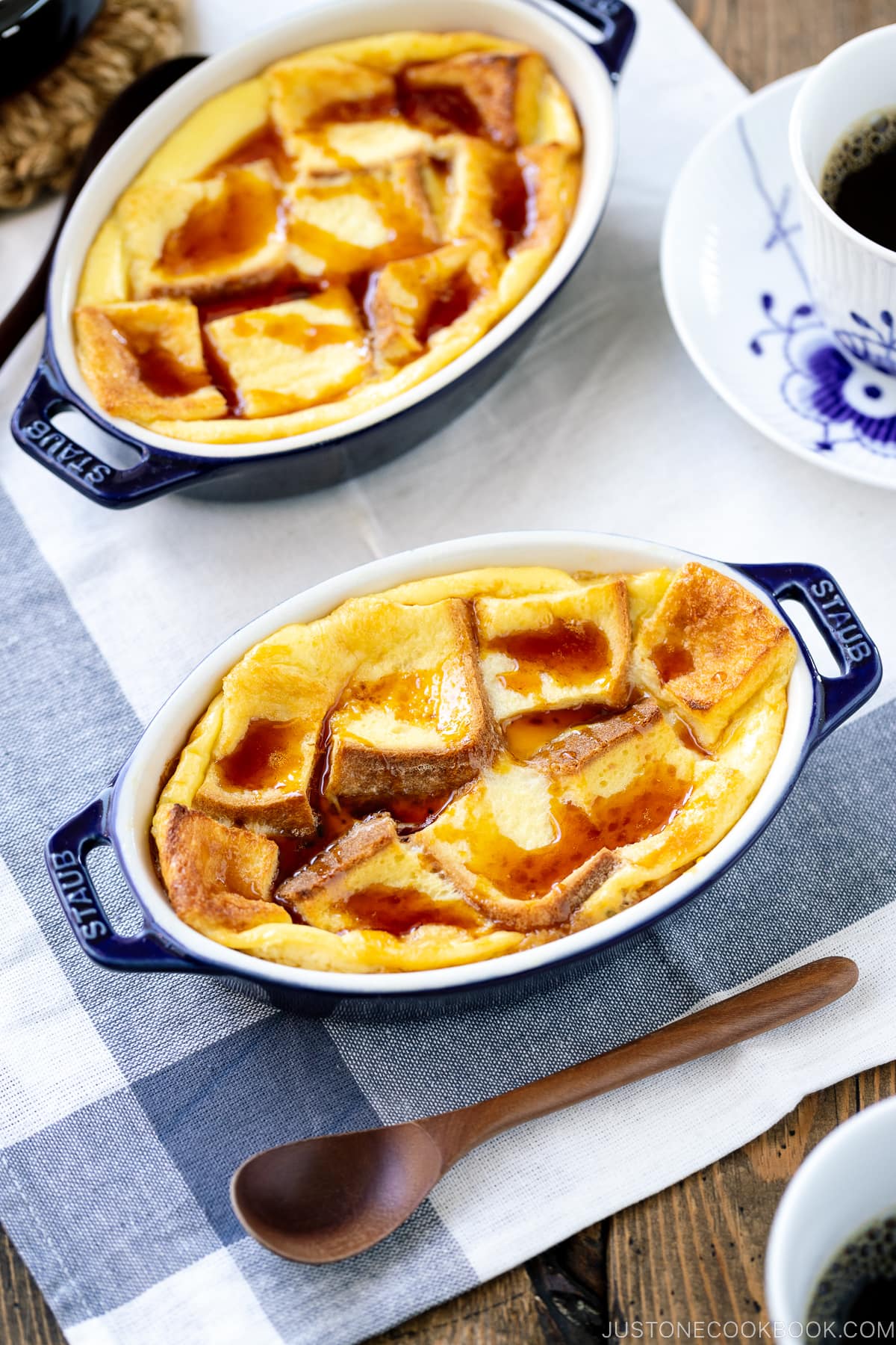 A gratin dish containing Pan Pudding (Japanese Bread Pudding) topped with a caramel sauce.