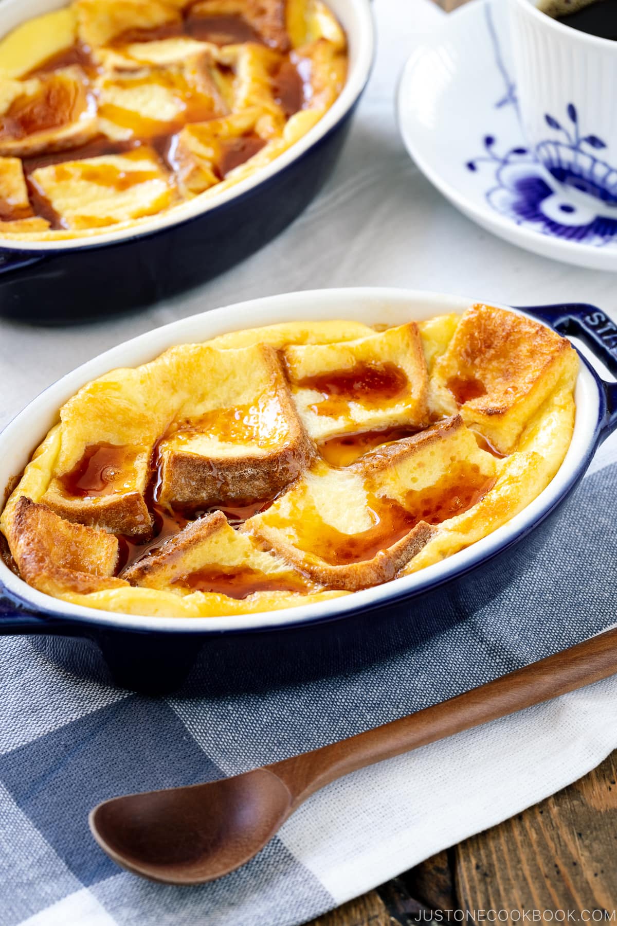 A gratin dish containing Pan Pudding (Japanese Bread Pudding) topped with a caramel sauce.